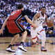 Kyle Lowry driving against Tyler Johnson on Sunday, via Getty.
